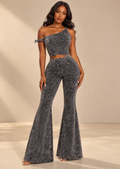 Model front view showing one-shoulder top, knots and flared pants