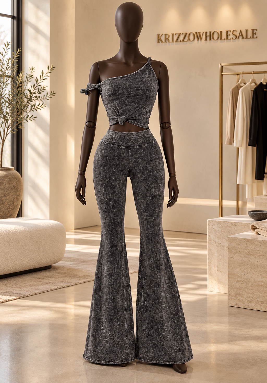 Charcoal one-shoulder two-piece set on fashion mannequin in Krizzowholesale showroom