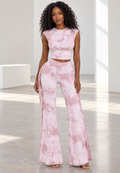 Blush pink tie-dye set on model, front view showing side fringe