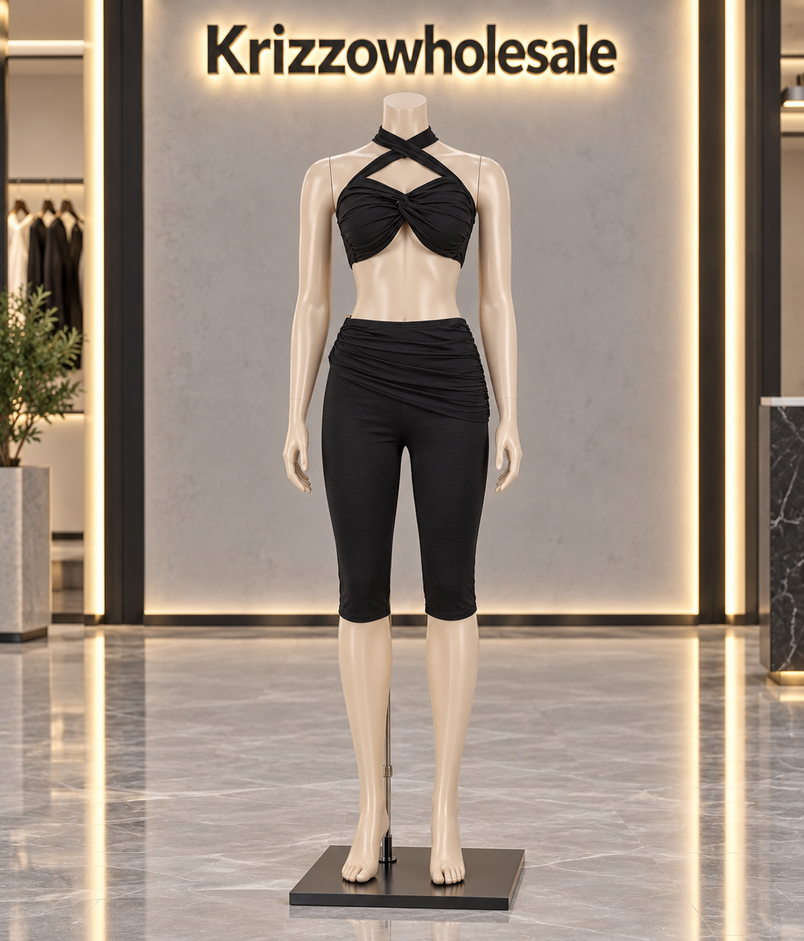 Black halter top and ruched biker shorts set on Krizzowholesale store mannequin