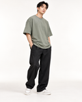Men's oversized sage T-shirt on model