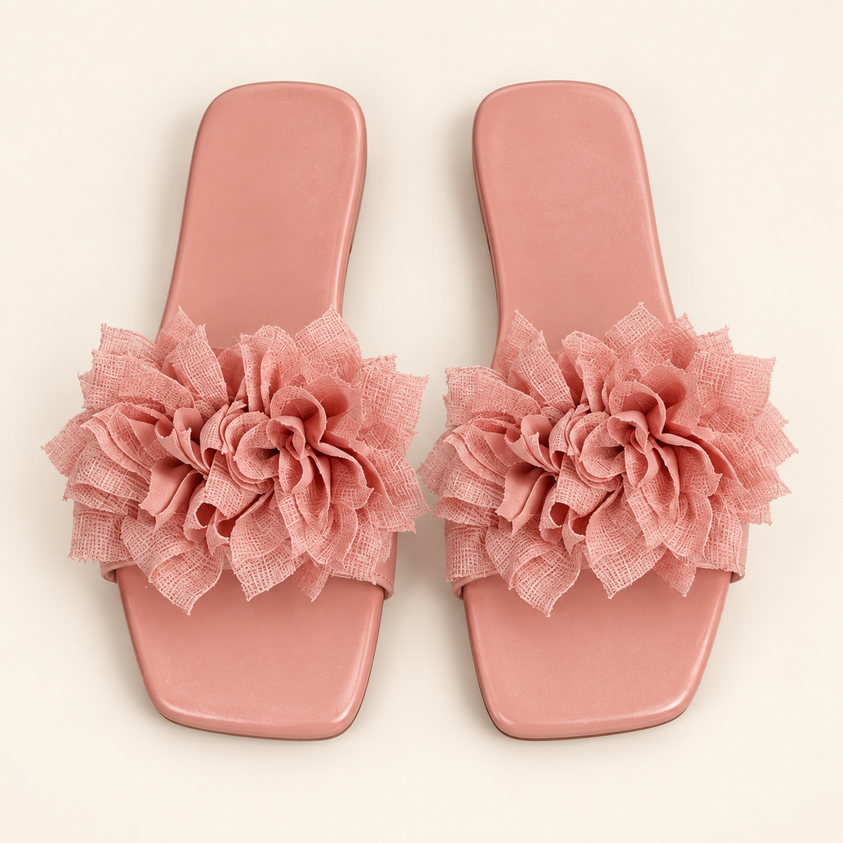 pink floral sandals on neutral background