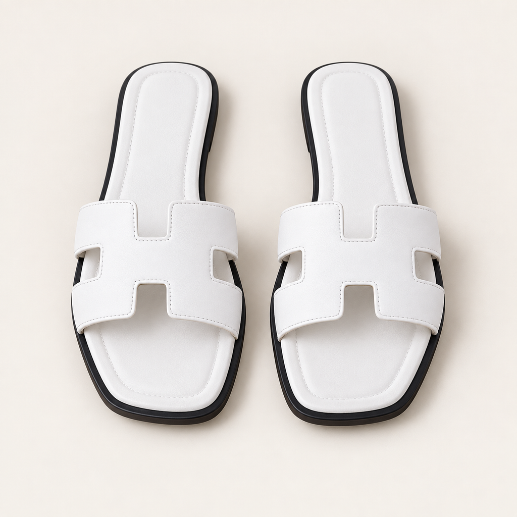 white fashion sandals on neutral background