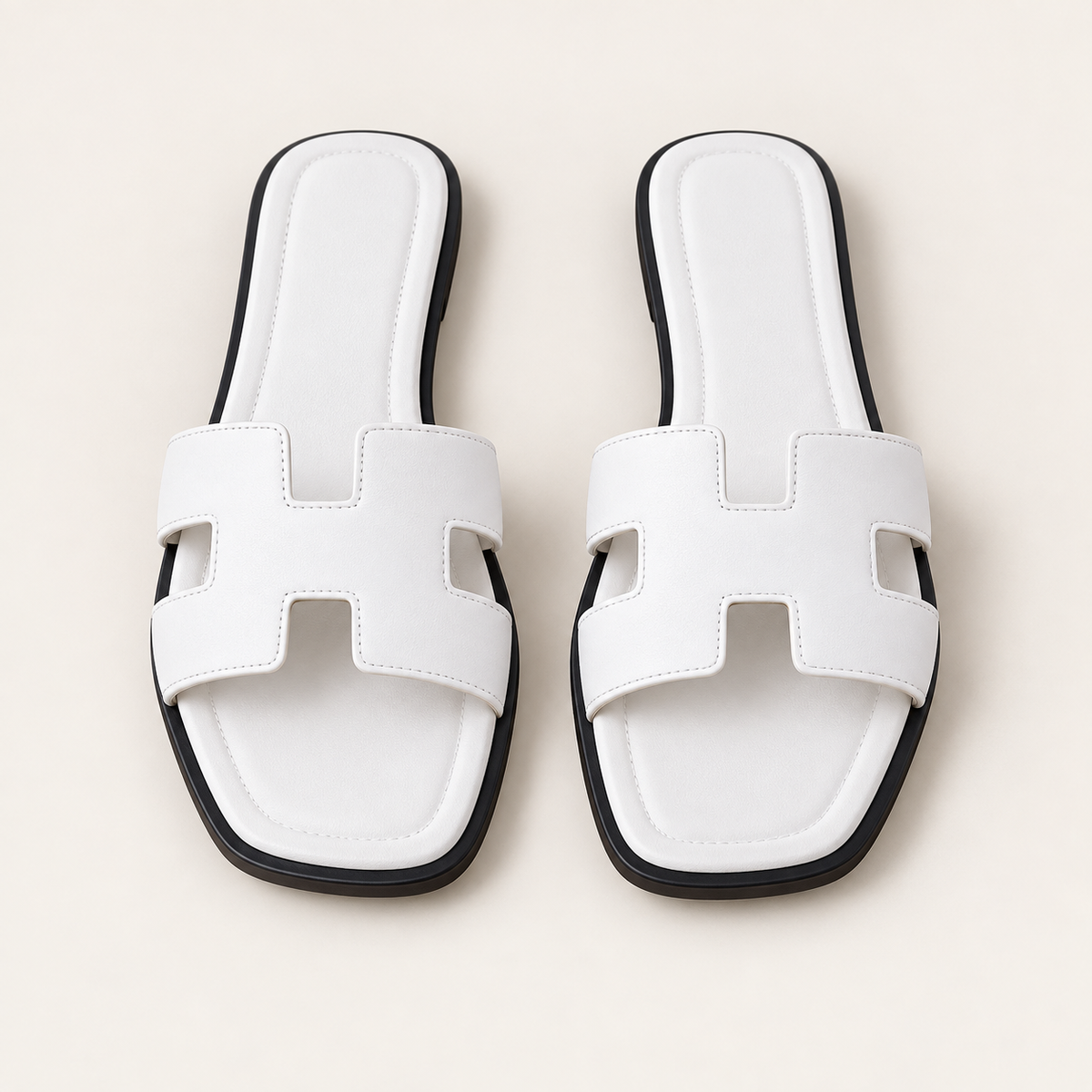 white fashion sandals on neutral background